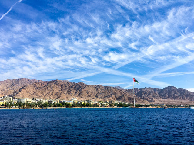 Flag of Jordan on the river in Aqaba