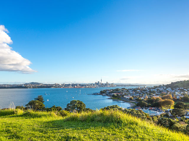 Stunning view of Auckland with city and house by the sea
