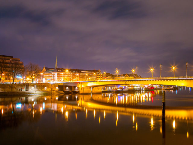 Bremen at night with river bridge, Germany