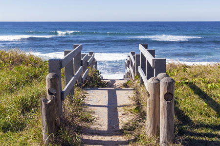 Rustic wooden walkwat leading to beach, Durban