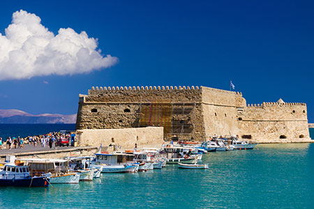 Port of Iraklion with clear blue sea, Greece