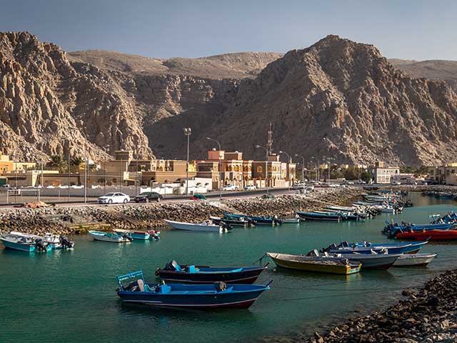 Boats anchored in the river in Khasab, Oman