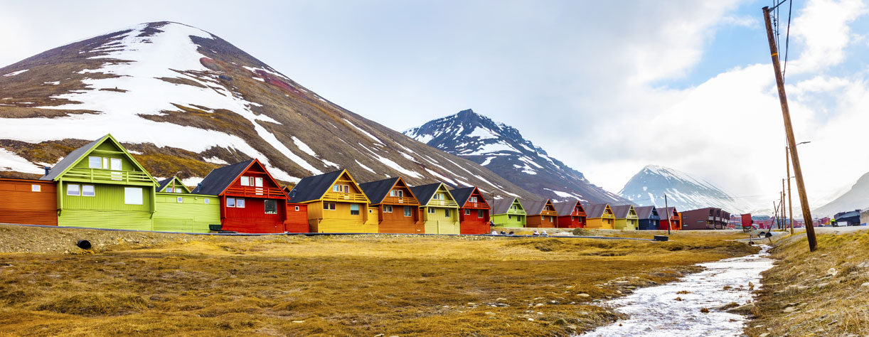 Colourful houses and mountains in background, Svalbard