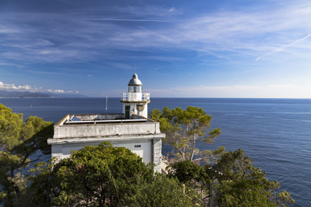 Historic Lighthouse, Faro di Portofino overlooking the ocean, Italy