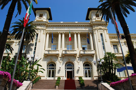 Casino white facade with palm trees in Sanremo