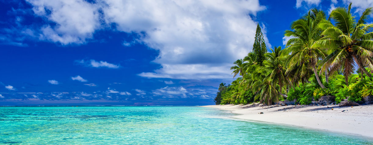 Amazing beach with white sand and palm trees on Rarotonga, Cook Islands 