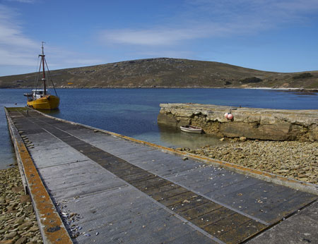  Converted trawler tied up on the jetty at the West Point Settlement on West Point Island in the Falkland Islands