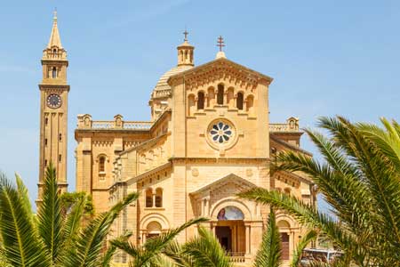 Malta palm leaves and Ta 'Pinu Church in village Gharb Gozo island 