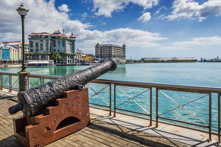 Old cannon on the promenade at Caudan Waterfront Port Louis