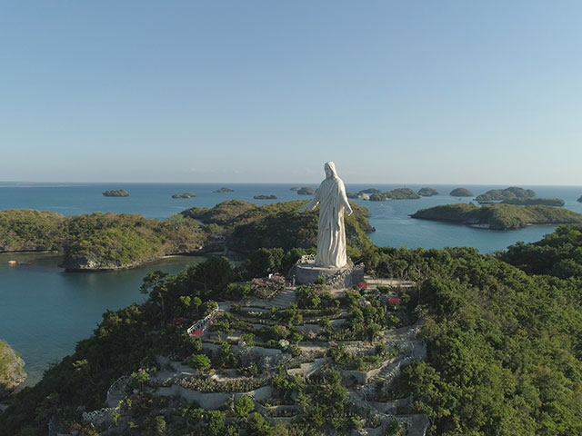 Statue of Jesus Christ on Pilgrimage island in Hundred Islands National Park, Phillippines