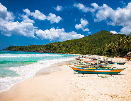 Traditional boats on Sabang beach, Puerto Princesa, Palawan island. Philippines .