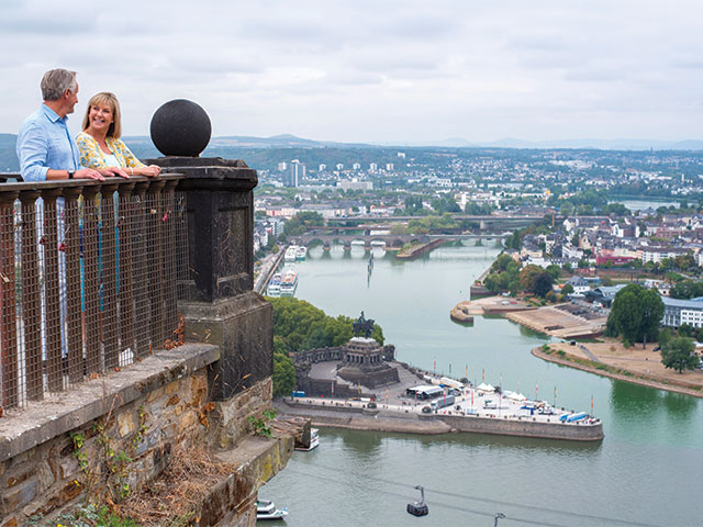 Couple looking out to Koblenz, Germany Couple looking out to Koblenz, Germany