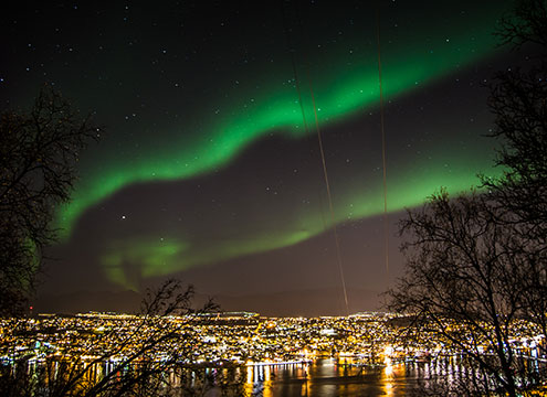 Spectacular Northern Lights over Tromso at night In Search of the Northern Lights in Nine Nights