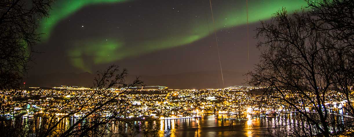 Spectacular Northern Lights over Tromso at night