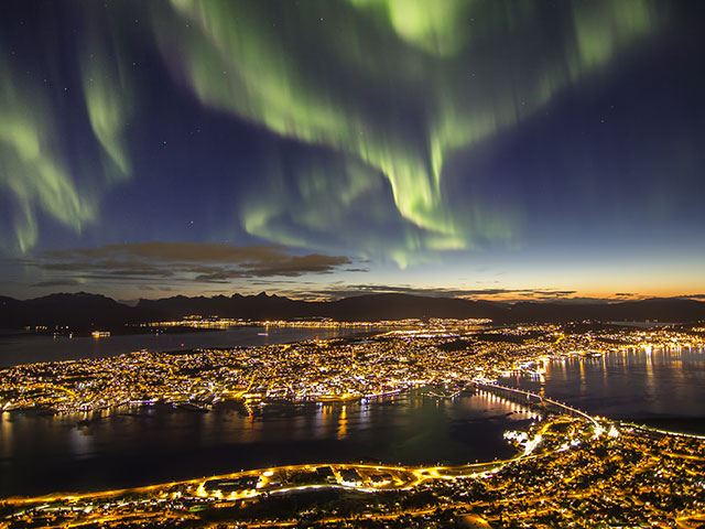 Spectacular Northern Lights over Tromso at night Spectacular Northern Lights over Tromso at night