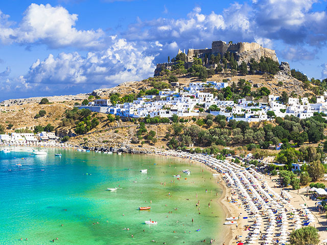Panoramic view of Lindos bay, village and Acropolis, Rhodes, Greece Panoramic view of Lindos bay, village and Acropolis, Rhodes, Greece