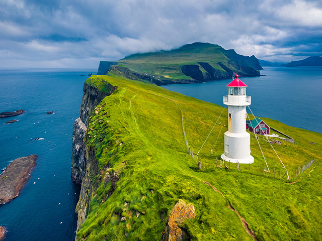 View of Mikines islands with old lighthouse, Faroe Islands