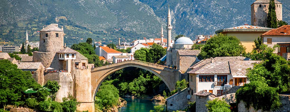 Beautiful view on Mostar city with old bridge and ancient buildings on Neretva river in Bosnia and Herzegovina