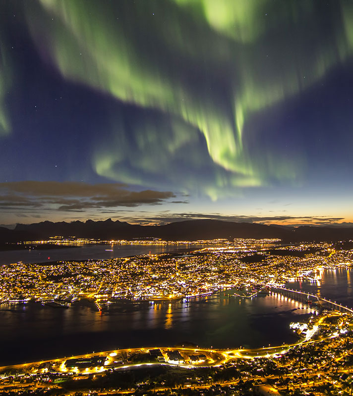Spectacular Northern Lights over Tromso at night Spectacular Northern Lights over Tromso at night