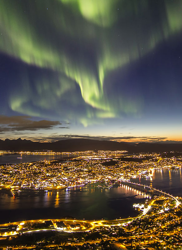 Spectacular Northern Lights over Tromso at night Spectacular Northern Lights over Tromso at night