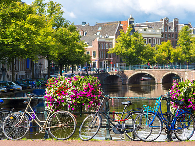 Bicycles over the bridge, canal, Amsterdam