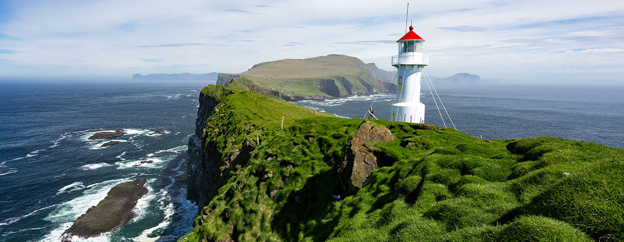 The beautiful lighthouse on Mykines island in Faroe Islands