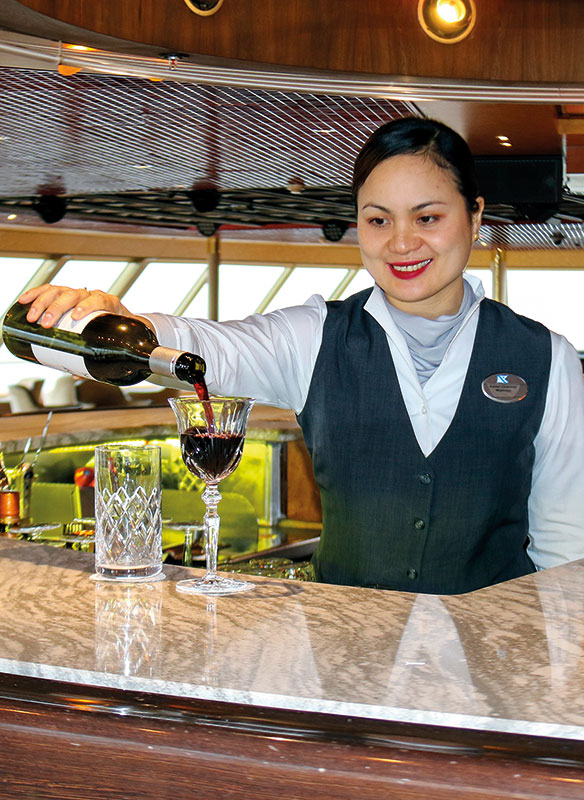 Waitress pouring drinks in The Observatory - Borealis Waitress pouring drinks in The Observatory - Borealis