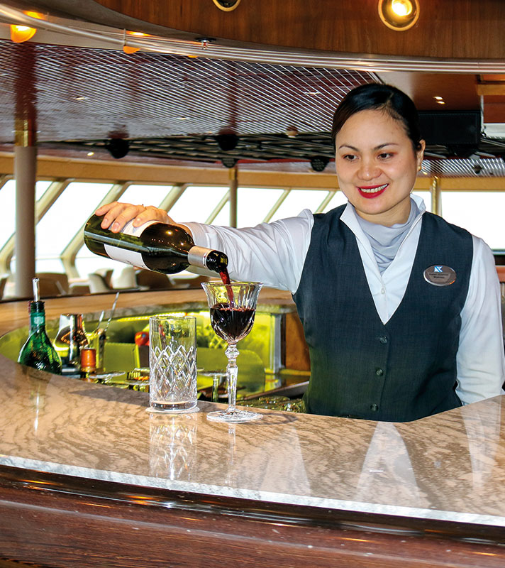 Waitress pouring drinks in The Observatory - Borealis Waitress pouring drinks in The Observatory - Borealis
