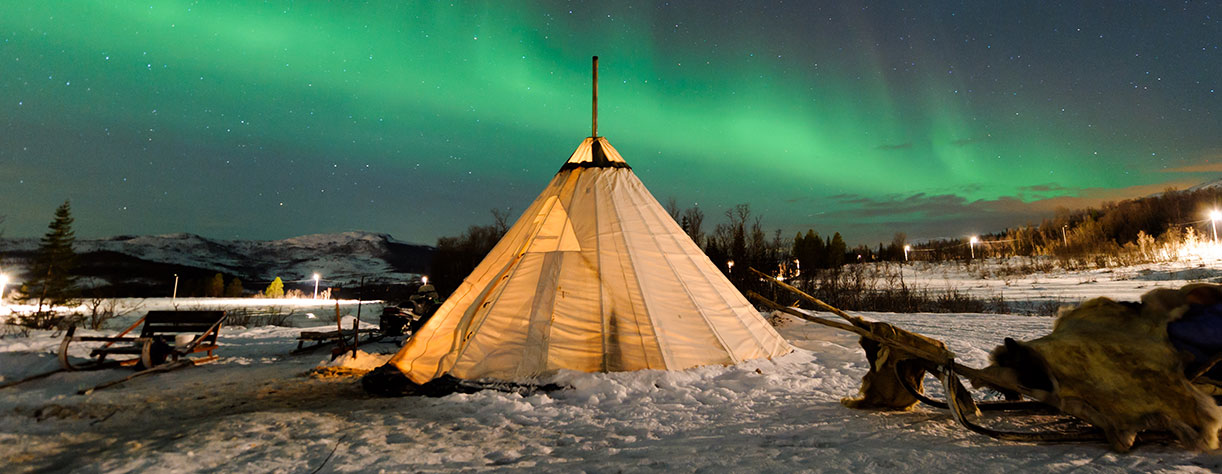 Traditional Sami reindeer-skin tents, The northern lights in Norway, Tromso Traditional Sami reindeer-skin tents, The northern lights in Norway, Tromso