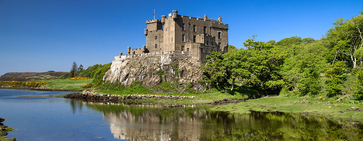 Reflection in water of Dunvegan castle, Scotland