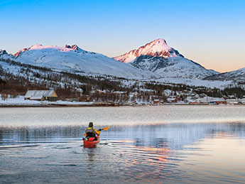 Take a shore tour kayaking on a winter Norway cruise 