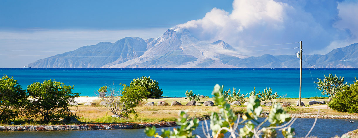 View to the active volcano in Montserrat with a large ash cloud.