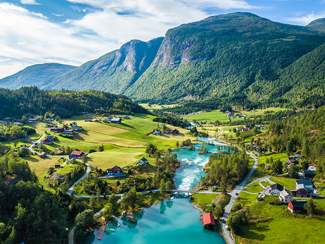 Aerial summer view of green water stream from Lovatnet lake, Norway 