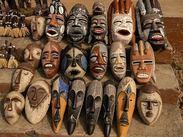Colourful african masks on a market stall in Benin, Africa