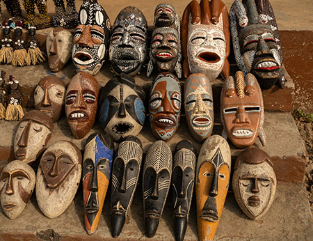 Colourful african masks on a market stall in Benin, Africa