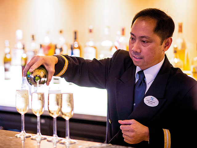 Barman pouring sparkling wine