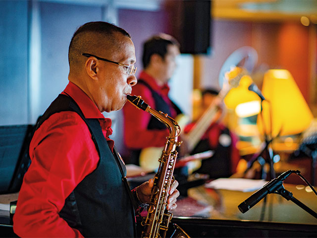 Saxophone player in the Oceans Bar, Bolette