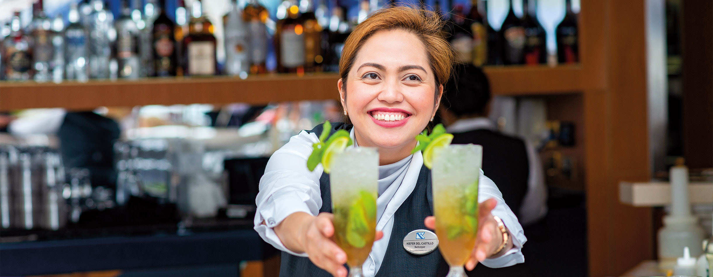 Bar staff with cocktails in the lido bar