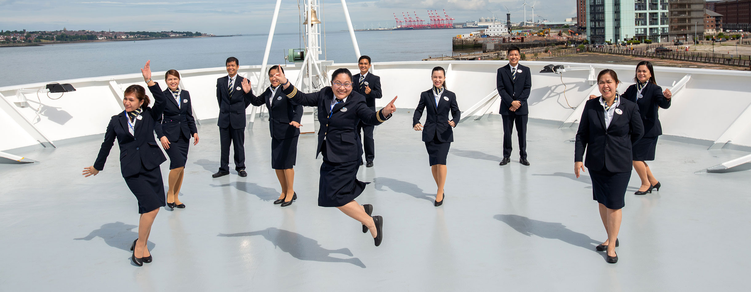 Crew jumping and smiling 