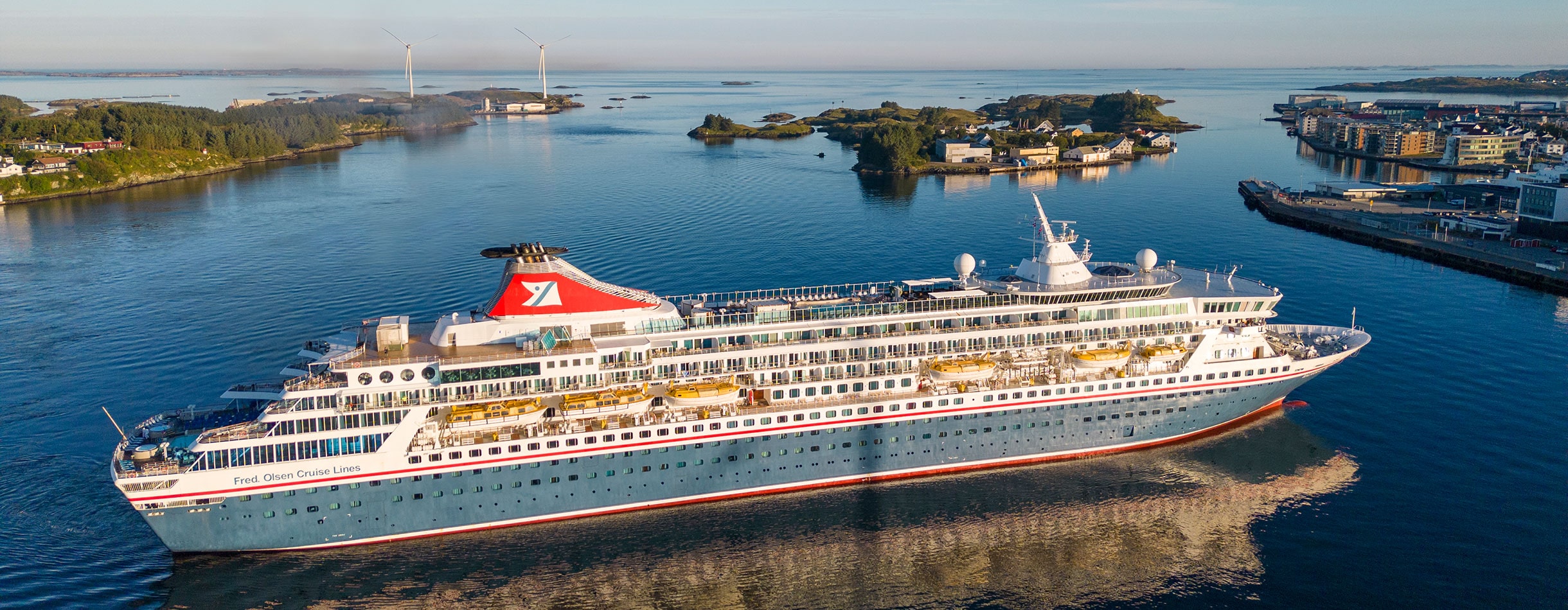 The Balmoral ship approaching Haugesund, Norway, with a view of the surrounding landscape