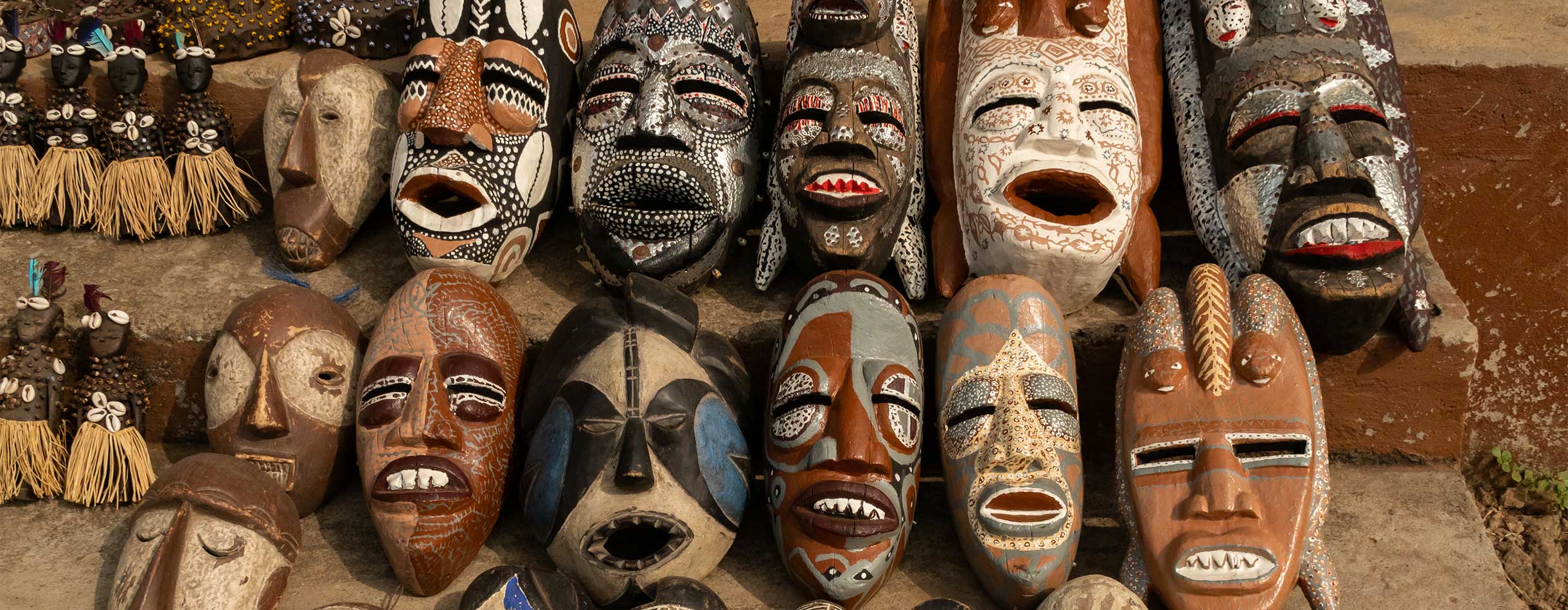 Colourful African masks on a market stall, Benin, Africa 