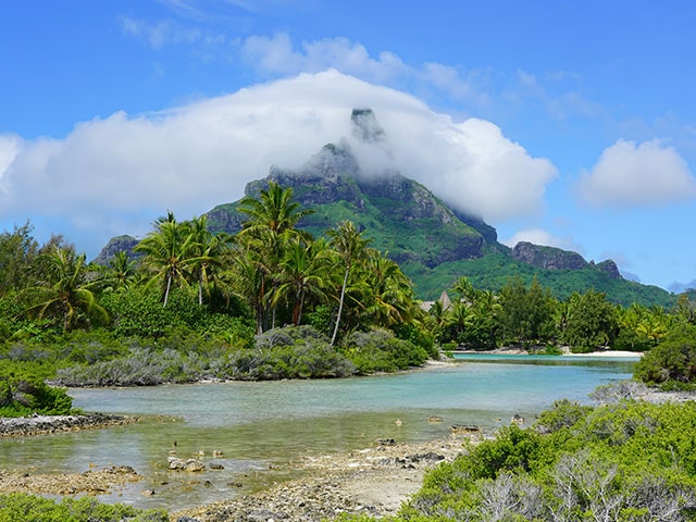 View of the Mont Otemanu mountain reflecting in water in Bora Bora, French Polynesia, South Pacific