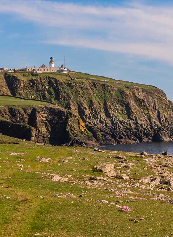 Beautiful view over the rocks towards the lighthouse, Sumburgh