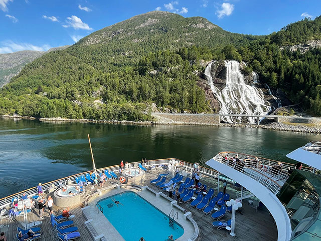 Balmoral cruising by Furebergsfossen waterfall, Norway