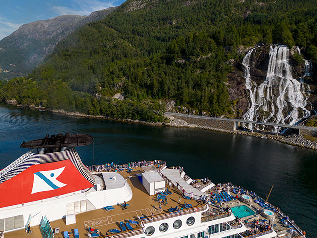 Balmoral cruising by Furebergsfossen waterfall, Norway