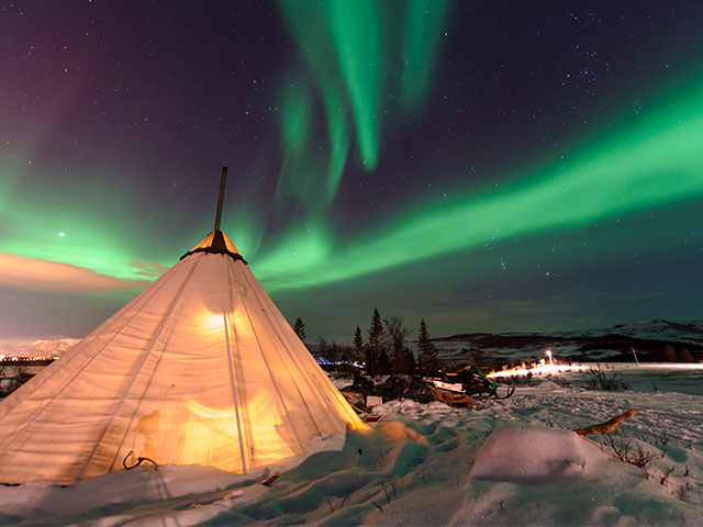 Northern lights over Sami tent, Tromso, Norway