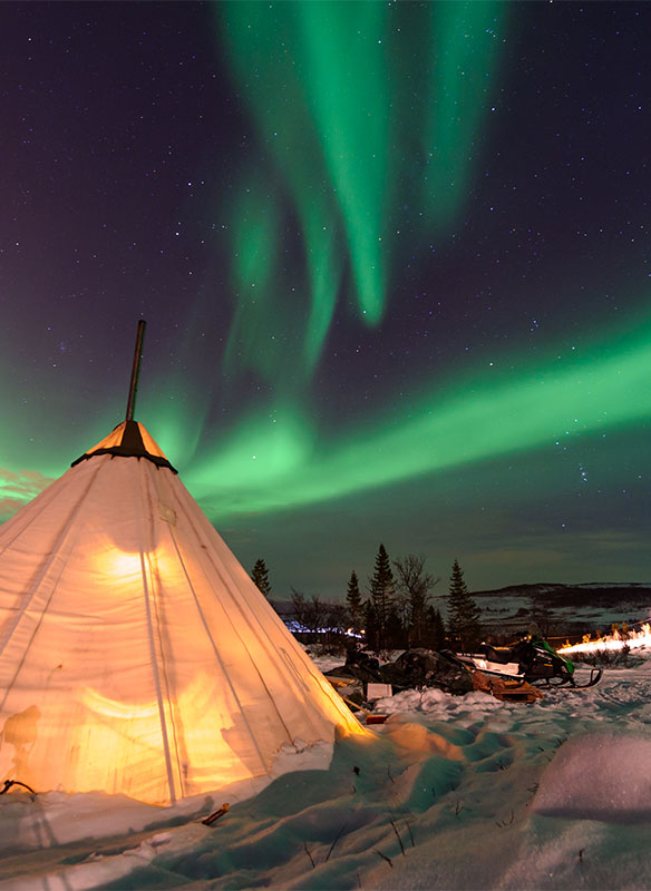 Northern lights over Sami tent, Tromso, Norway