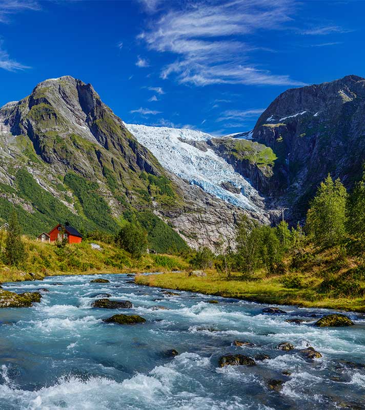 A stunning view of the Briksdal Glacier near Olden, Norway, with icy blue formations and surrounding mountains. A stunning view of the Briksdal Glacier near Olden, Norway, with icy blue formations and surrounding mountains.