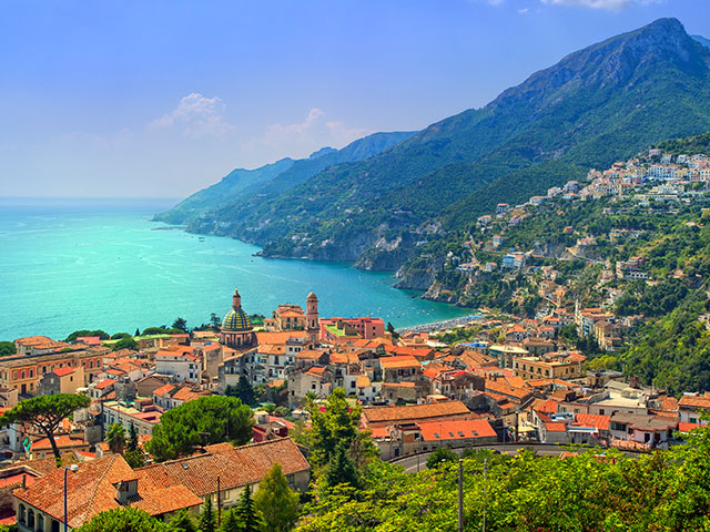 Morning view of Amalfi cityscape on coast line of mediterranean sea, Italy