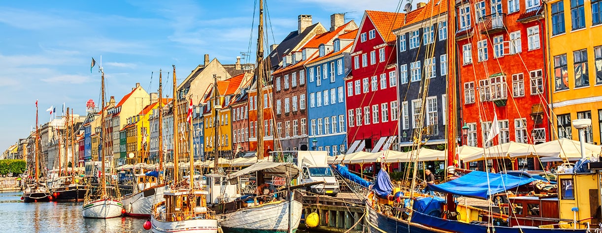 Famous old Nyhavn port in the center of Copenhagen, Denmark during summer sunny day